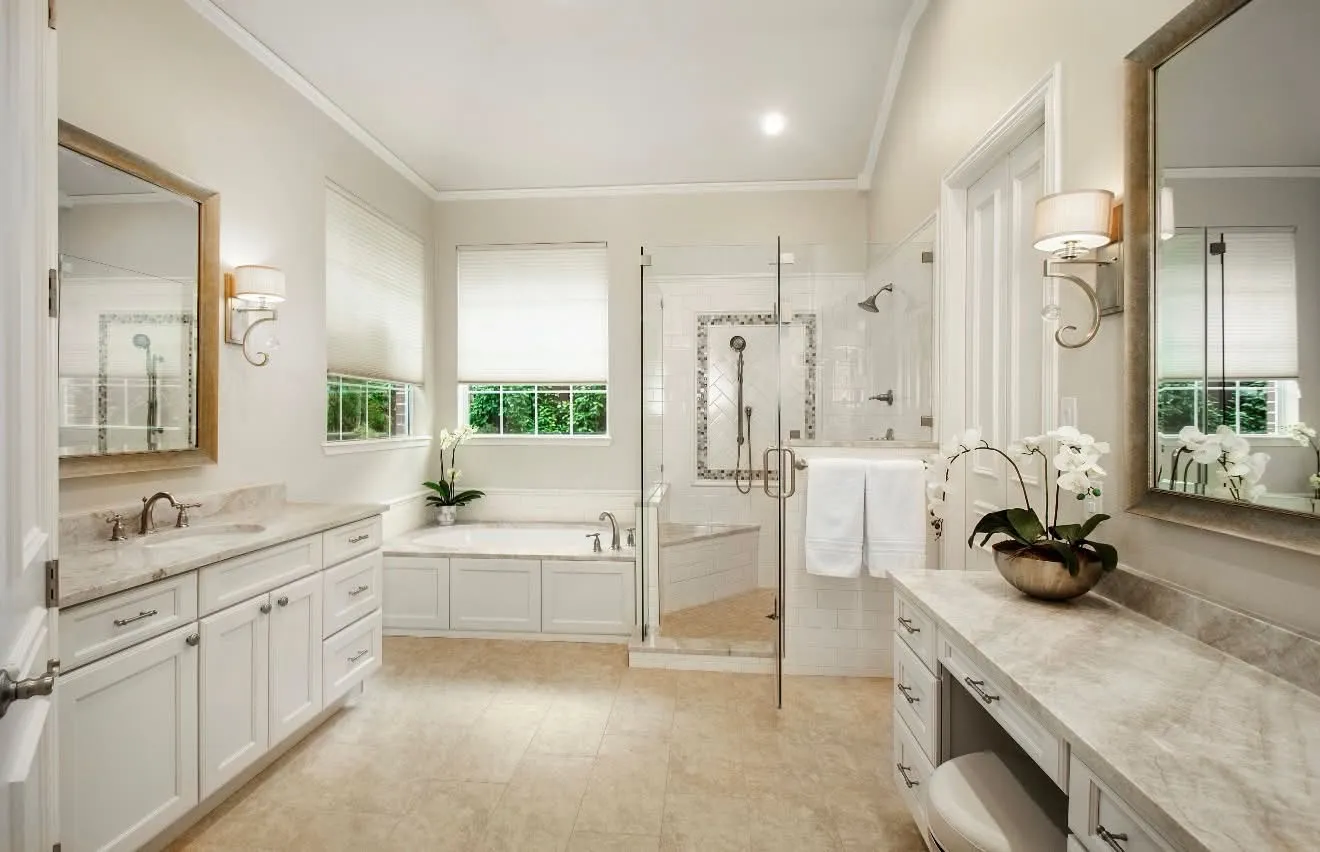 Primary bathroom remodel with double vanities, frameless glass shower and soaking tub